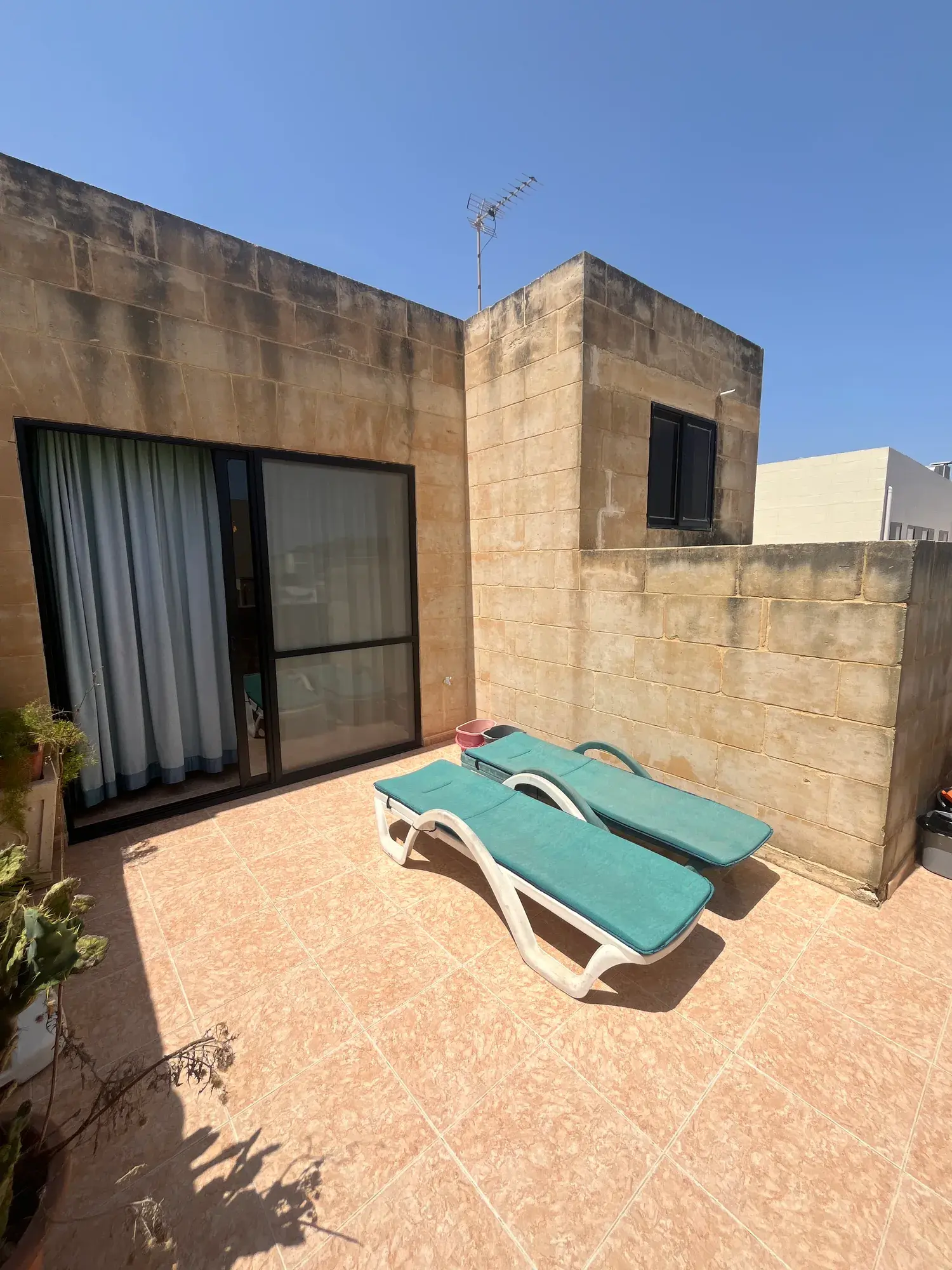Sun loungers on the open-air terrace at Vicmar Penthouse